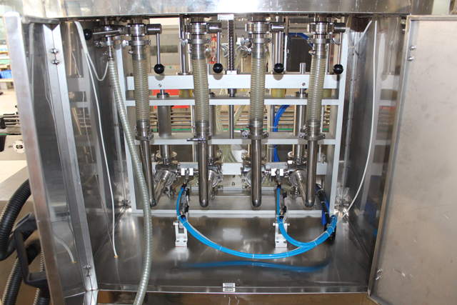 ماكينة تعبئة 4 رؤوس (2).JPG