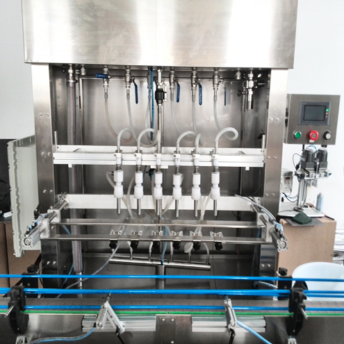 6 heads overflow filling machine آلات تعبئة الفائض.jpg