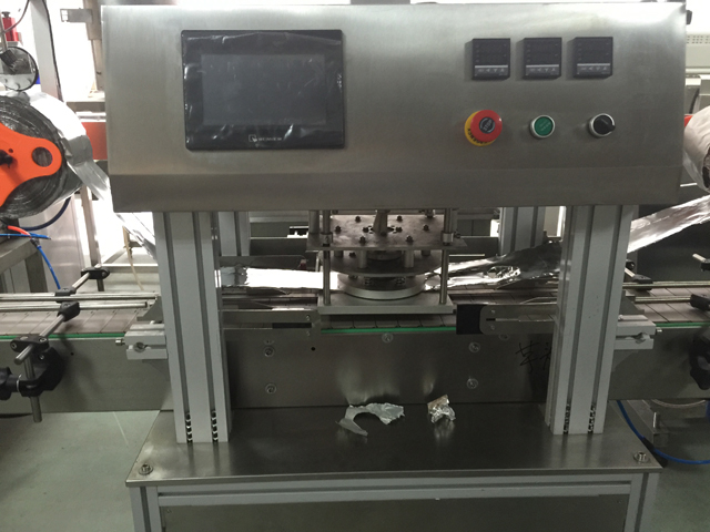 آلة غلق البرطمانات.jpg