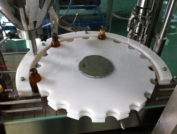 rotary mould for powder filling آلة تعبئة وختم المساحيق.jpg