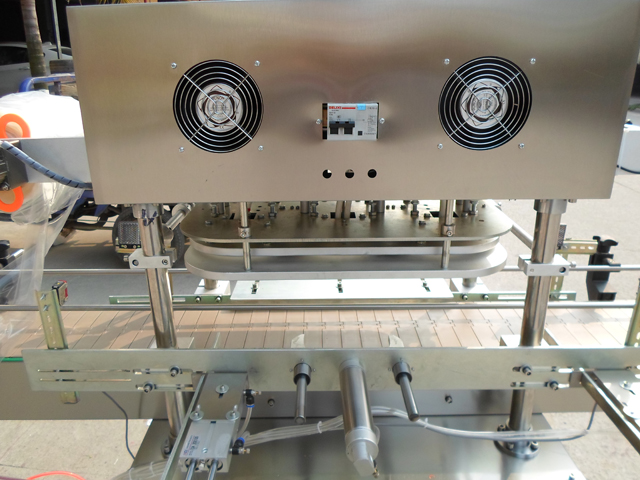 stainless steel frame for jars sealign machinery آلة ختم رقائق الألومنيوم الأوتوماتيكية.jpg