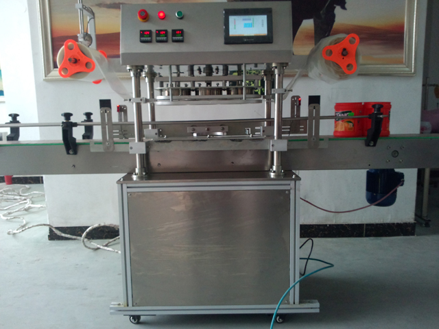 automatic three heads jars sealing equipment آلة غلق البرطمانات.jpg