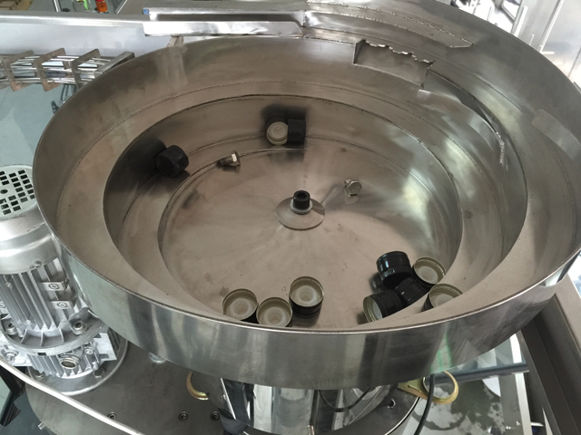 نظام تغذية هزاز الأغطية.jpg