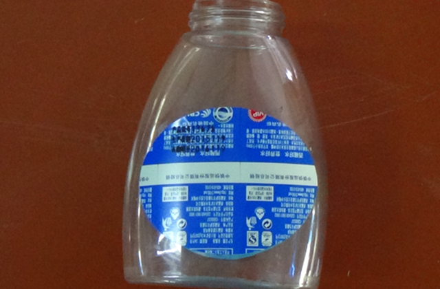 ماكينة وضع العلامات الدوارة على عينات الزجاجات المسطحة.jpg