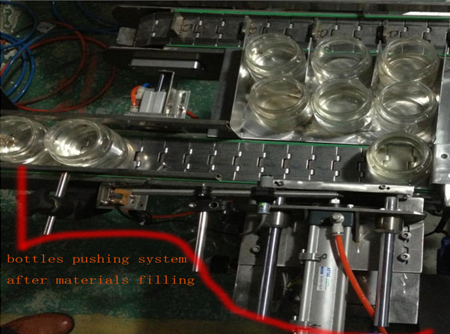 automatic bottles pushing system after filing نظام دفع الزجاجة.jpg